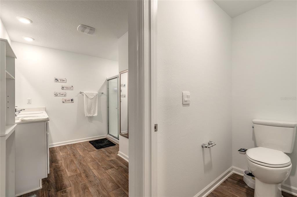 82 Hulett Wds Road Palm Coast, FL 32137 - Photo 24 of 48 a bathroom with a sink toilet and shower