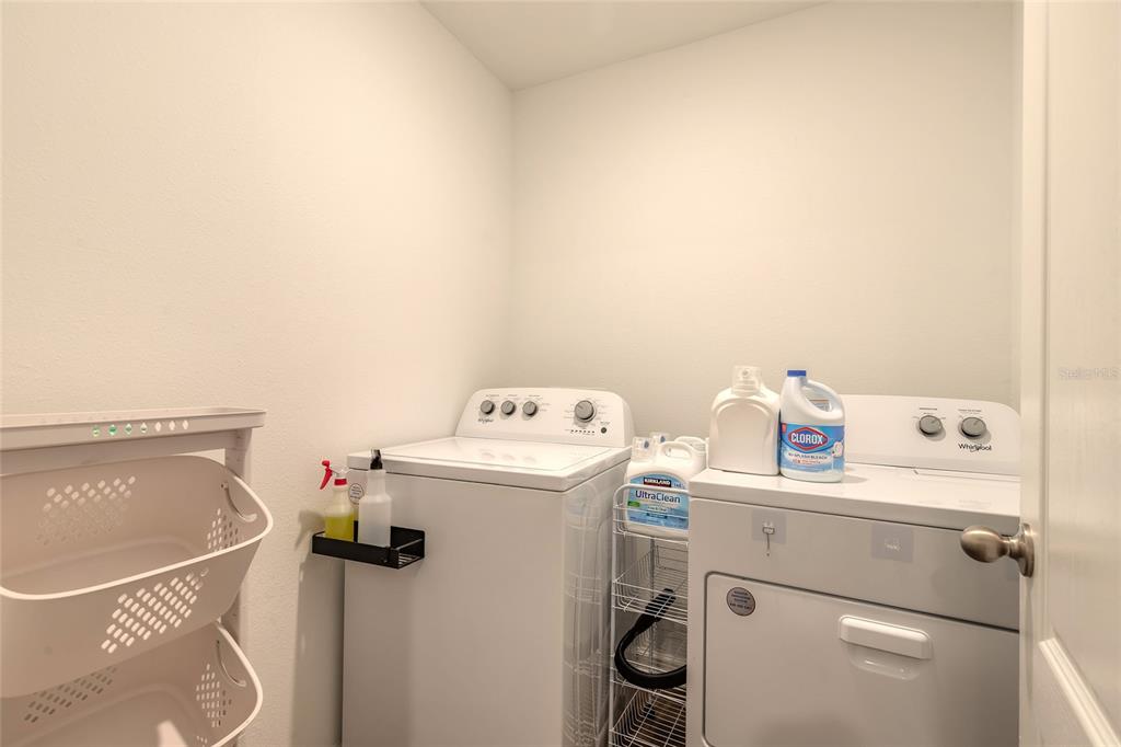 82 Hulett Wds Road Palm Coast, FL 32137 - Photo 32 of 48 a utility room with dryer and washer