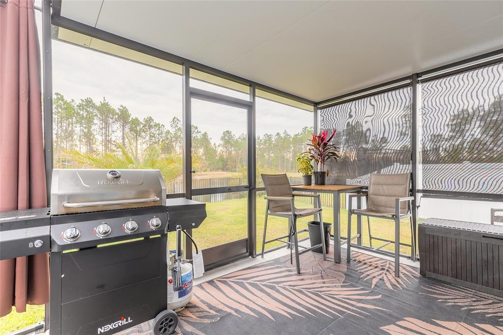 82 Hulett Wds Road Palm Coast, FL 32137 - Photo 36 of 48 a view of a living room with a floor to ceiling window and a floor to ceiling window