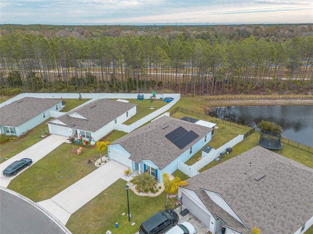 82 Hulett Wds Road Palm Coast, FL 32137 - Photo 42 of 48 a view of a swimming pool with a patio