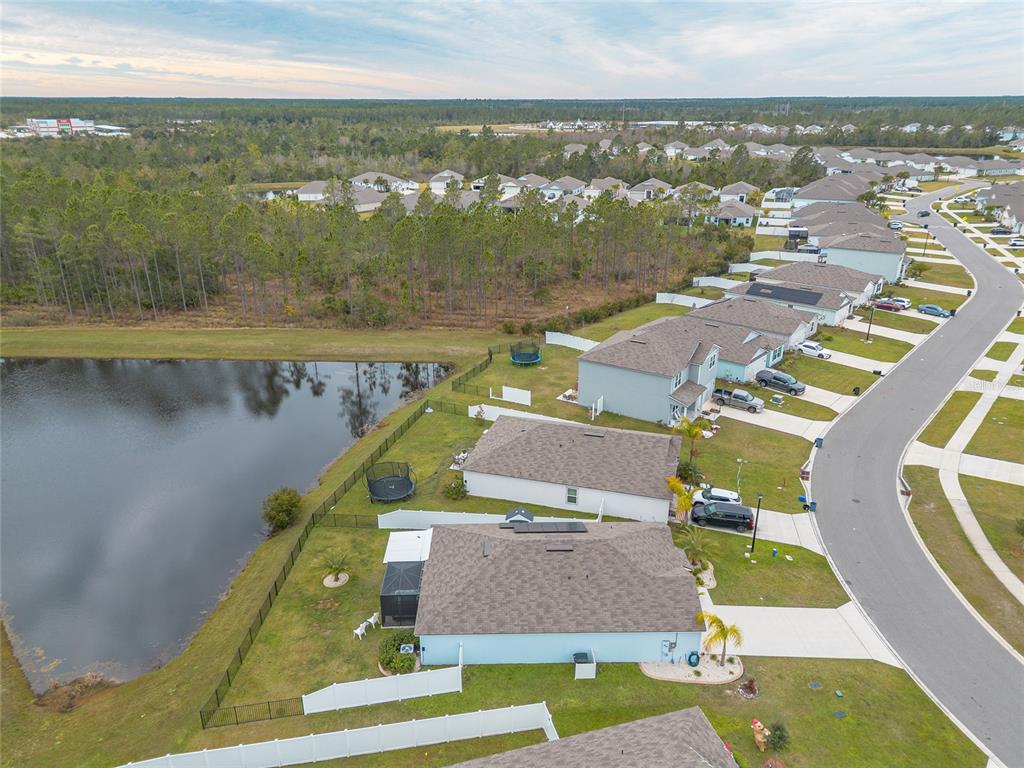82 Hulett Wds Road Palm Coast, FL 32137 - Photo 47 of 48 an aerial view of residential houses with outdoor space and swimming pool