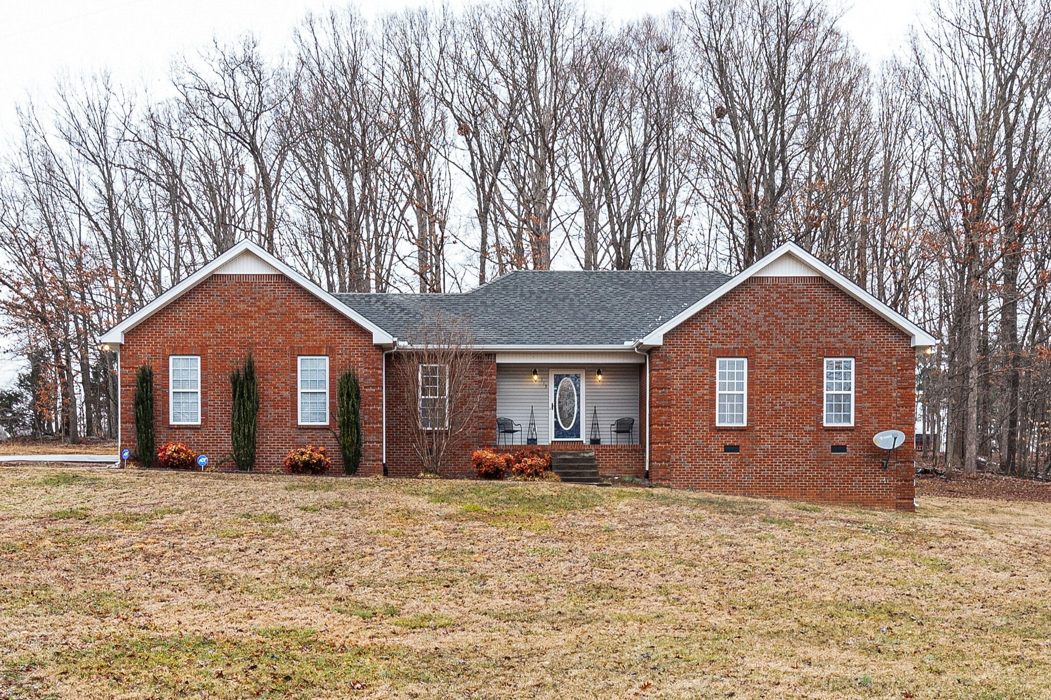 113 Lear Road Portland, TN 37148 - Photo 2 of 28 a front view of a house with yard and trees