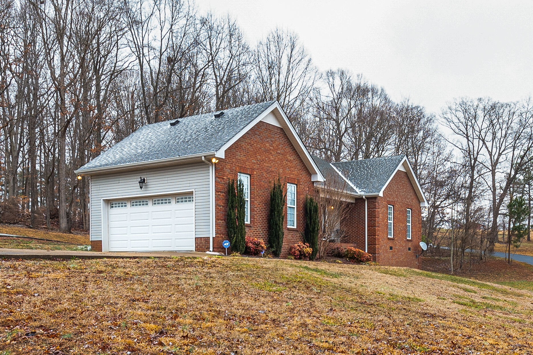 113 Lear Road Portland, TN 37148 - Photo 3 of 28 a front view of a house with a yard and garage