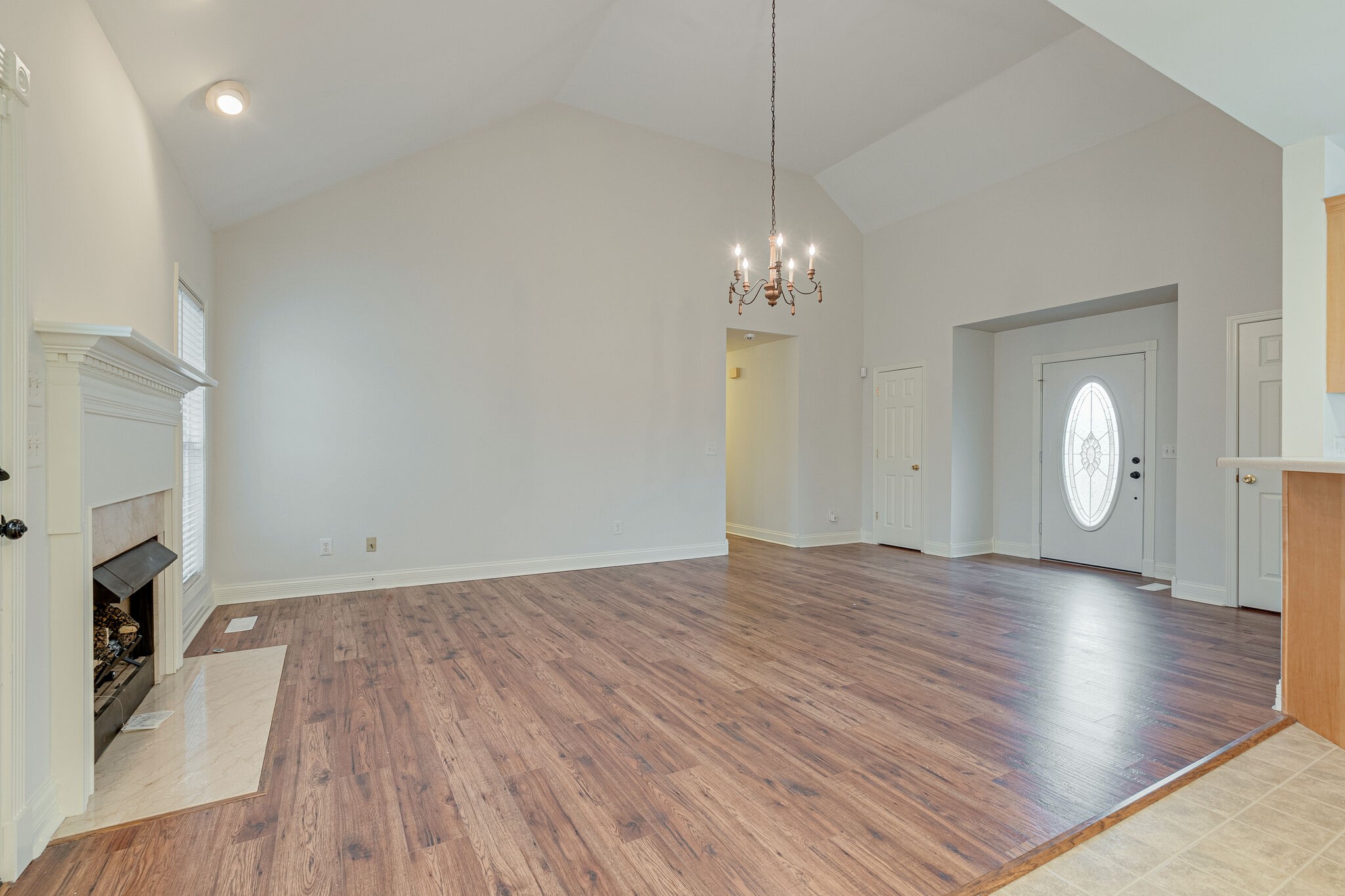 113 Lear Road Portland, TN 37148 - Photo 7 of 28 a view of a livingroom with wooden floor and a fireplace