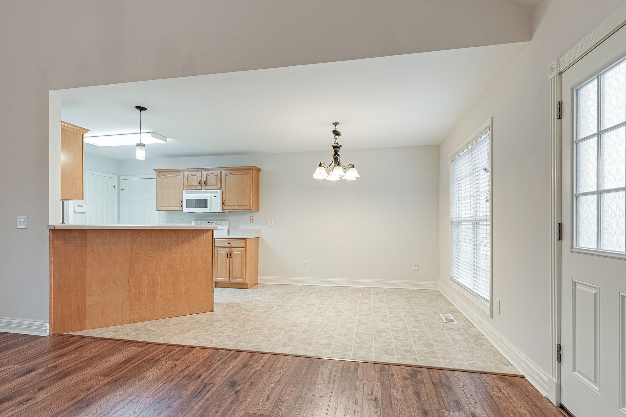 113 Lear Road Portland, TN 37148 - Photo 9 of 28 an empty room with wooden floor and windows