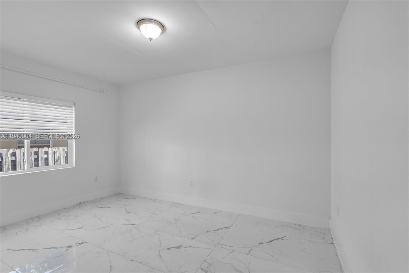 1786 Southwest 14th Terrace Miami, FL 33145 - Photo 19 of 41 an empty room with windows