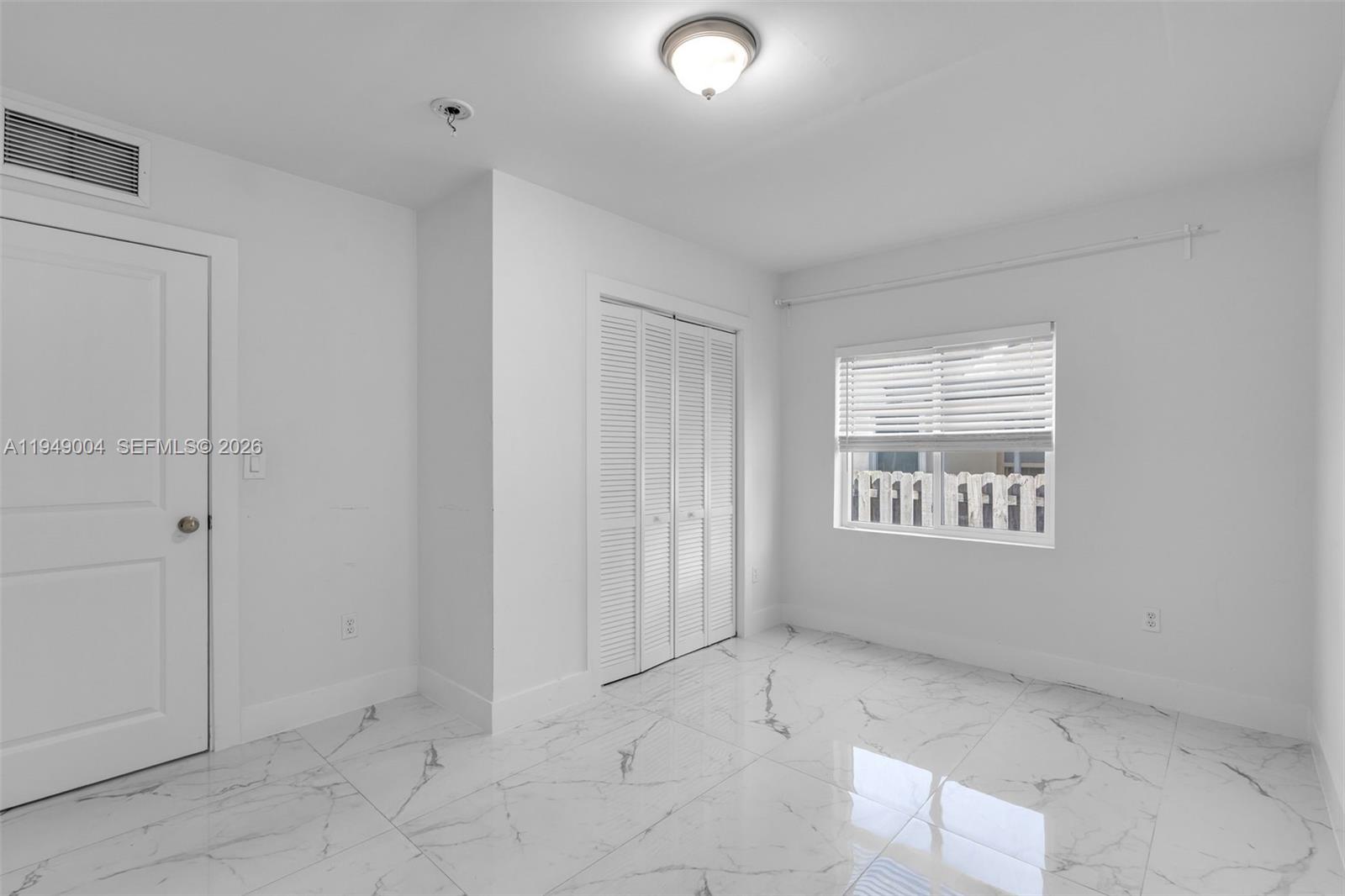 1786 Southwest 14th Terrace Miami, FL 33145 - Photo 21 of 41 an empty room with a empty space and windows