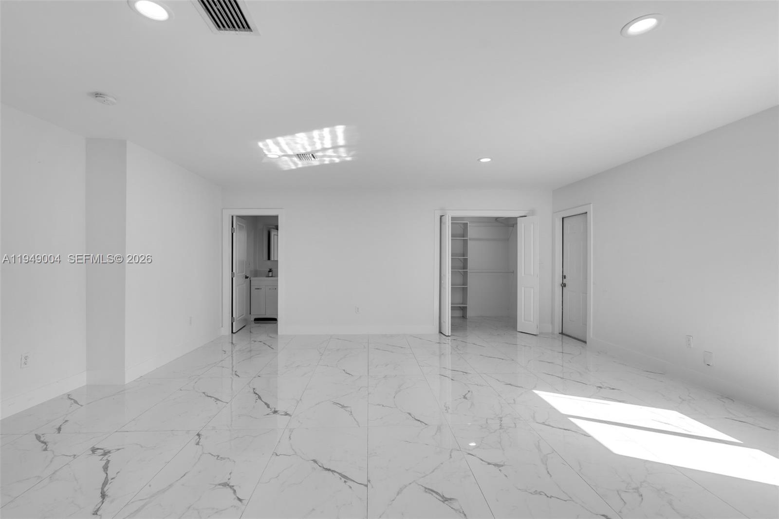 1786 Southwest 14th Terrace Miami, FL 33145 - Photo 28 of 41 an empty room with closet and windows