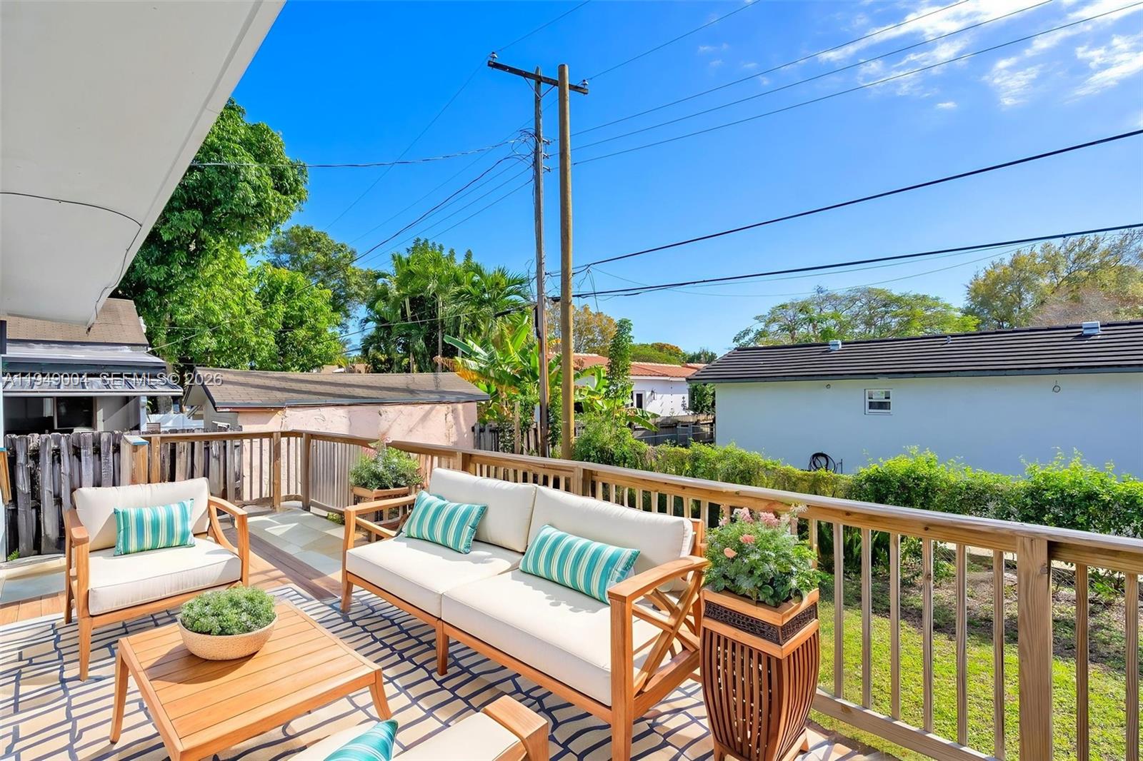 1786 Southwest 14th Terrace Miami, FL 33145 - Photo 36 of 41 a view of a wooden chairs in patio of the house