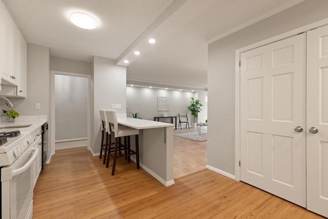 a view of a kitchen and dining room
