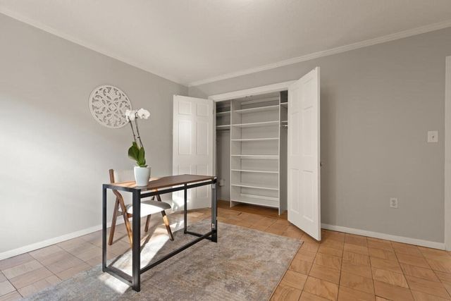a view of room with hardwood wall and a window