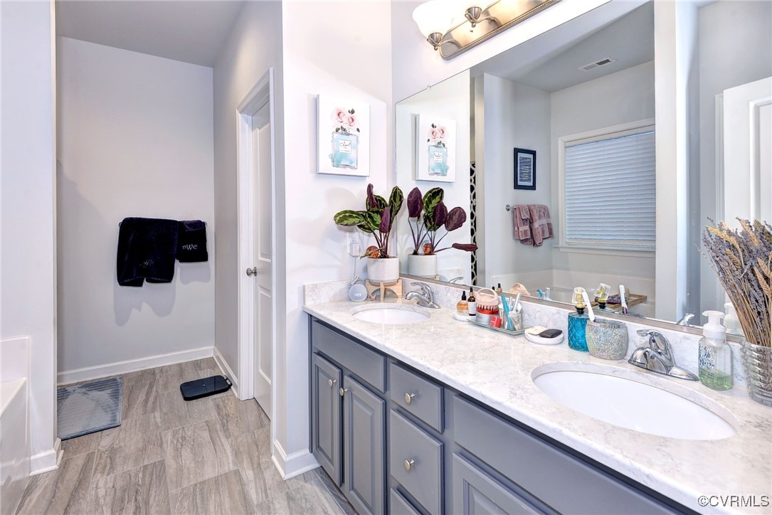 325 Martin Farm Road Yorktown, VA 23692 - Photo 22 of 50 Bathroom featuring a bathtub and vanity
