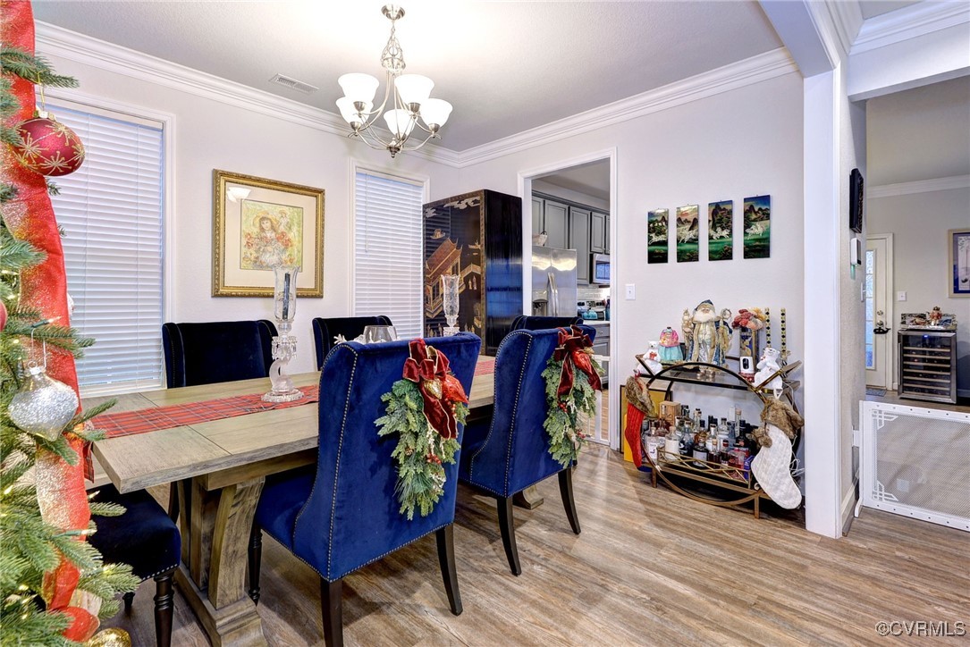 325 Martin Farm Road Yorktown, VA 23692 - Photo 8 of 50 Dining room with beverage cooler, ornamental moldi