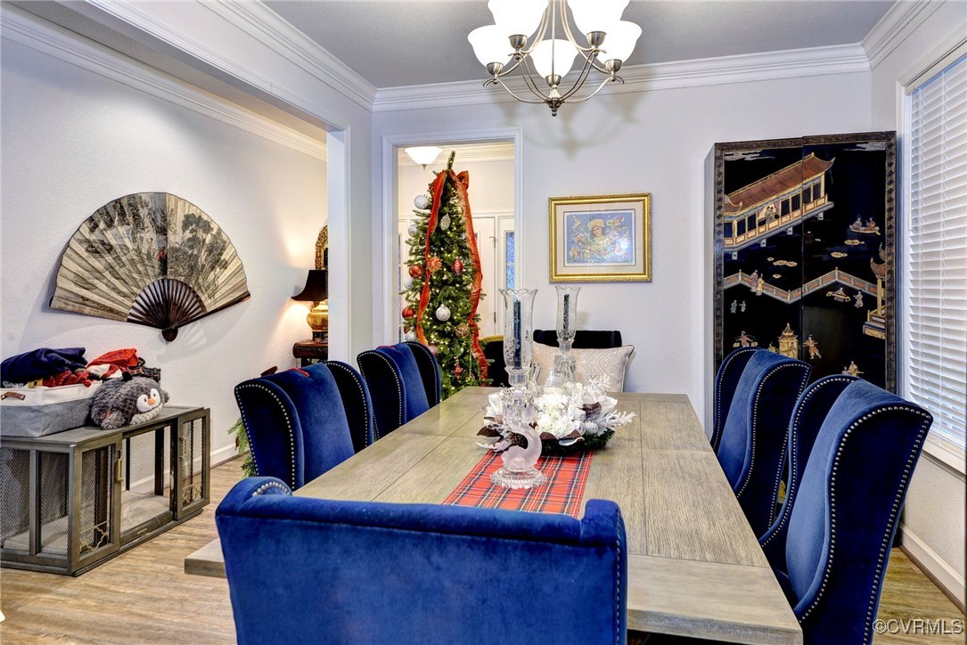 325 Martin Farm Road Yorktown, VA 23692 - Photo 10 of 50 Dining area with ornamental molding, hardwood / wo