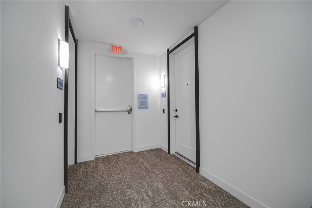 1310 Rivington Irvine, CA 92612 - Photo 17 of 20 a view of hallway with a mirror