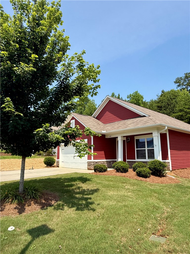 417 Laurel Grove Court Seneca, SC 29678 - Photo 2 of 10 A welcoming facade with a covered entry and attached garage, offering charming curb appeal.
