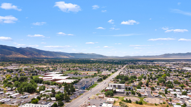 2875 North 400 West, Unit 7 Layton, UT 84041 - Photo 26 of 29 Expansive aerial perspective showcasing a broad urban landscape with distant mountains
