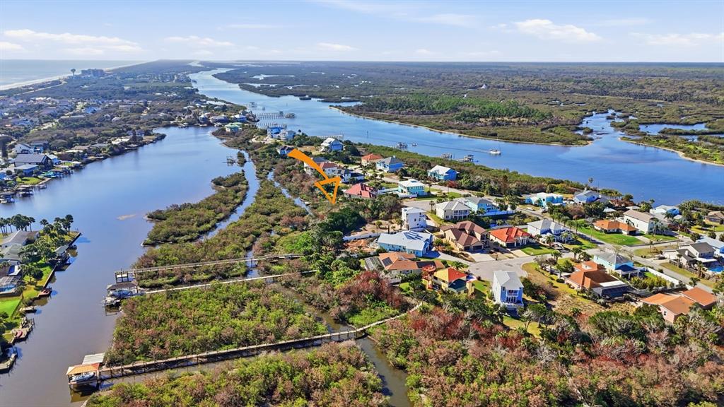 570 Springdale Drive Flagler Beach, FL 32136 - Photo 8 of 15 an aerial view of residential houses with outdoor space