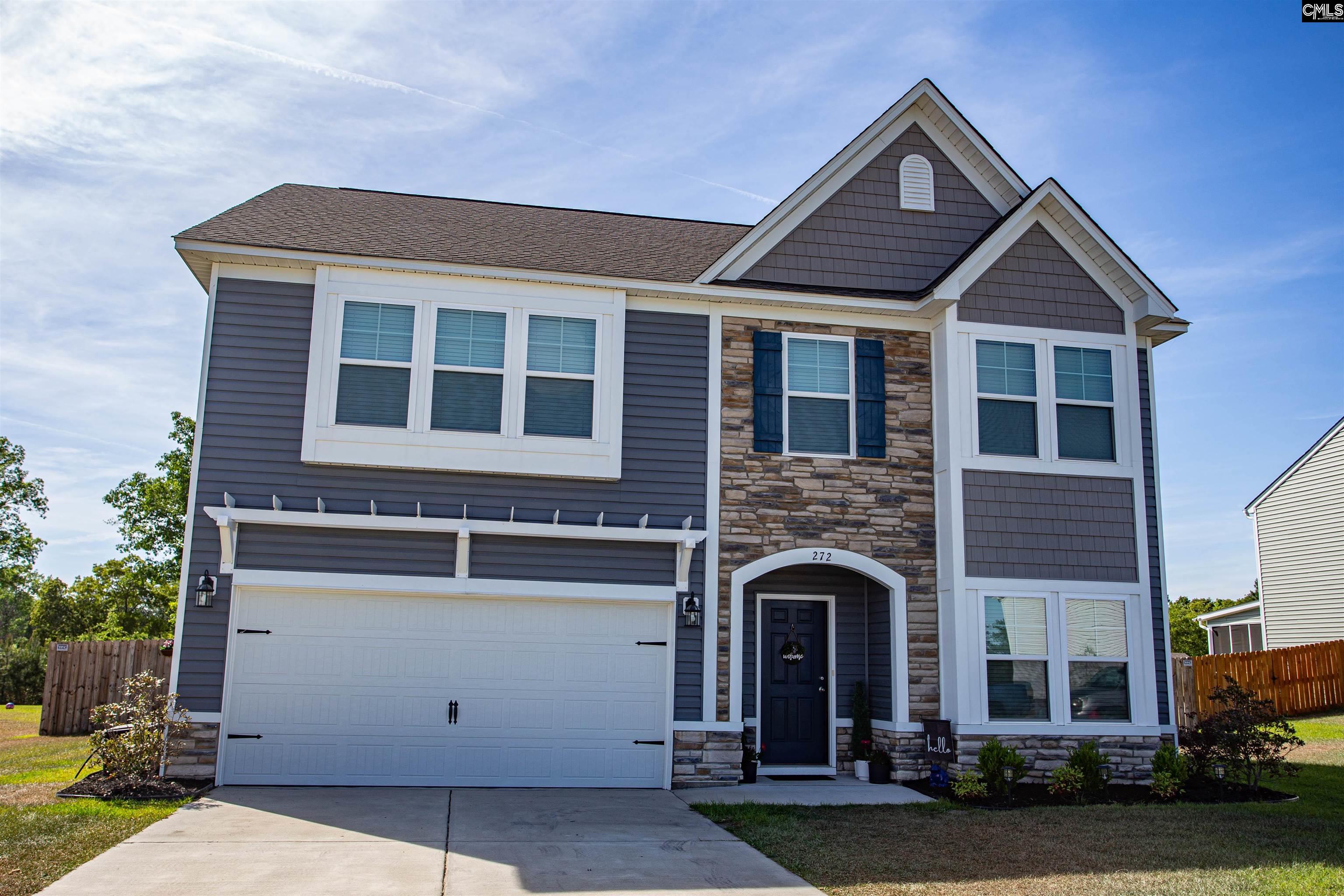 272 Shadowbrook Way Camden, SC 29020 - Photo 2 of 43 a front view of a house with garden