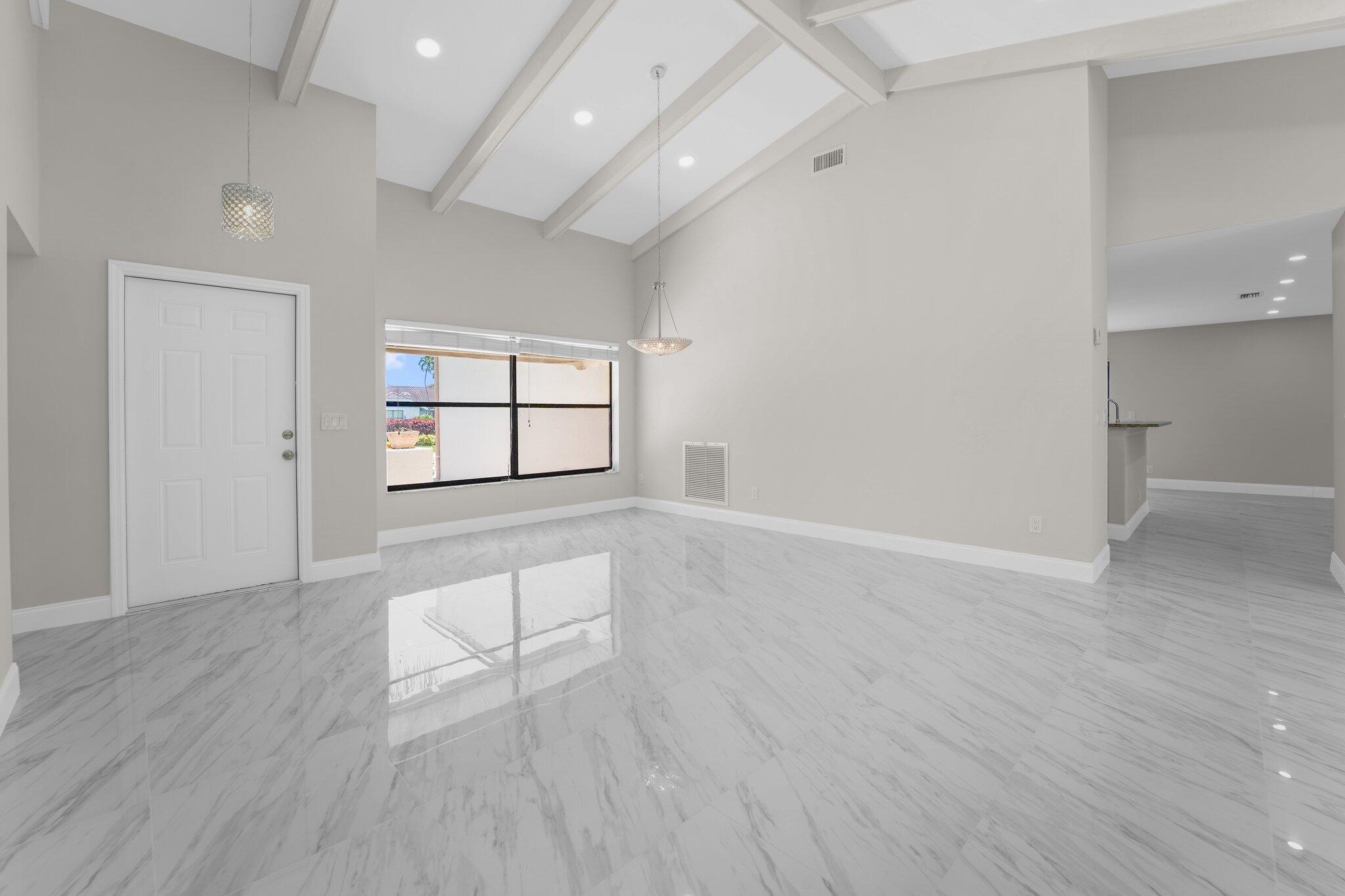 22207 Alyssum Way Boca Raton, FL 33433 - Photo 14 of 31 wooden floor in an empty room with a window