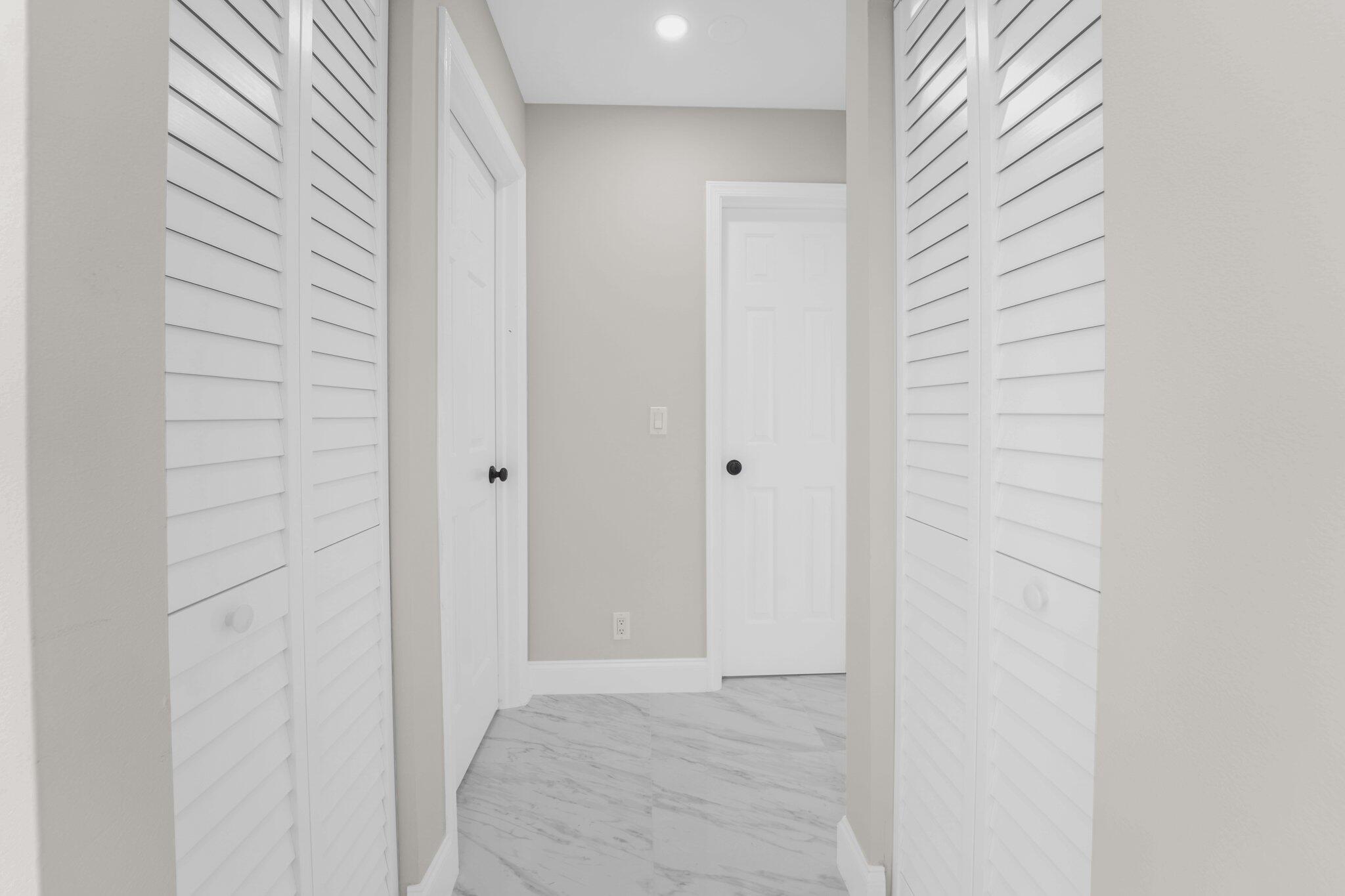 22207 Alyssum Way Boca Raton, FL 33433 - Photo 19 of 31 a view of hallway with shower
