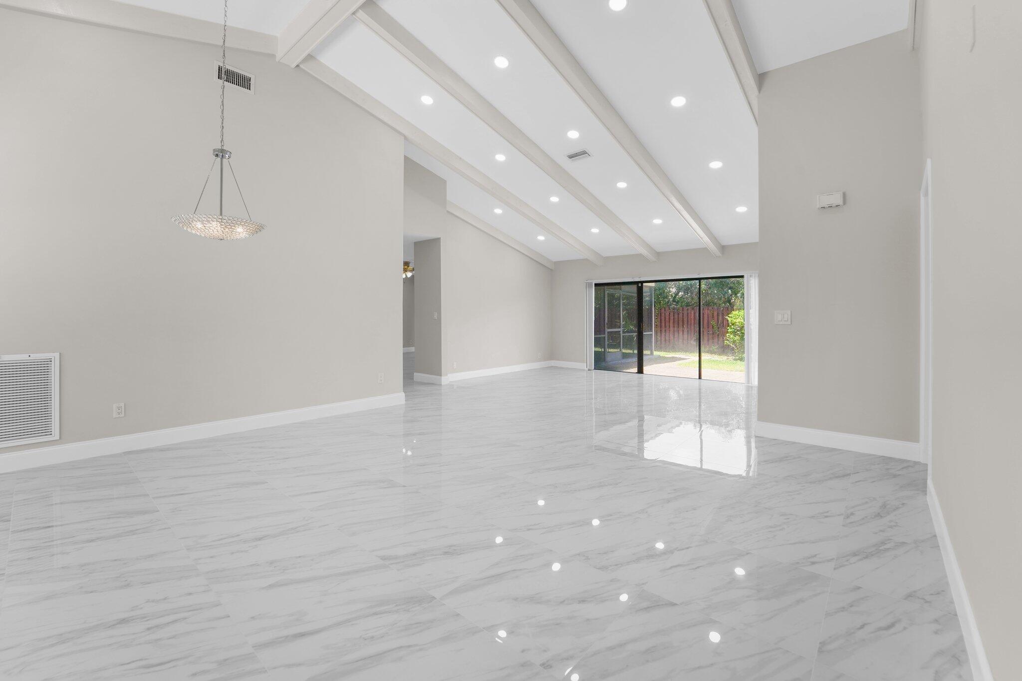 22207 Alyssum Way Boca Raton, FL 33433 - Photo 8 of 31 a view of an empty room with wooden floor