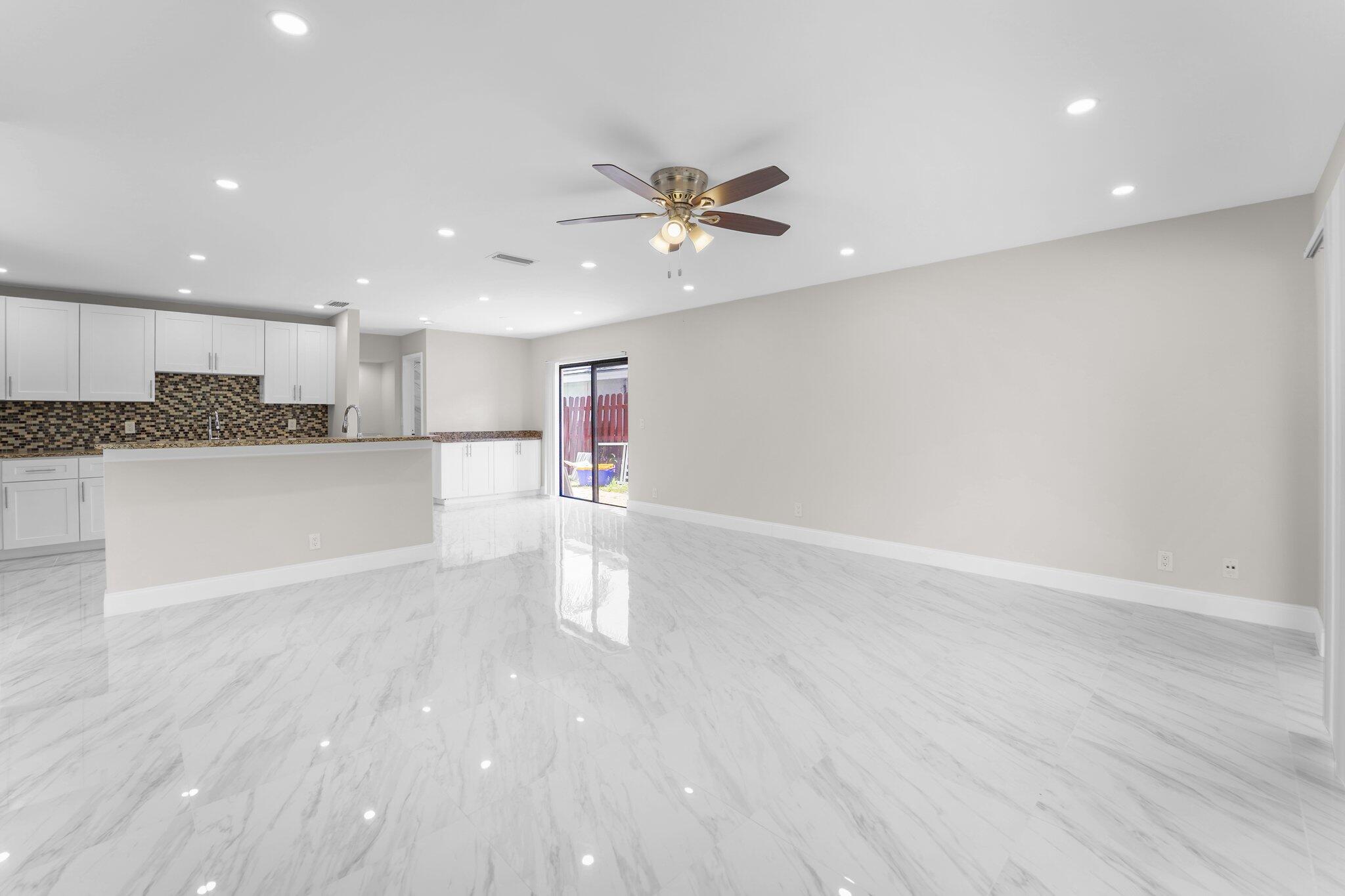 22207 Alyssum Way Boca Raton, FL 33433 - Photo 9 of 31 a view of a kitchen with a dishwasher stove and cabinets