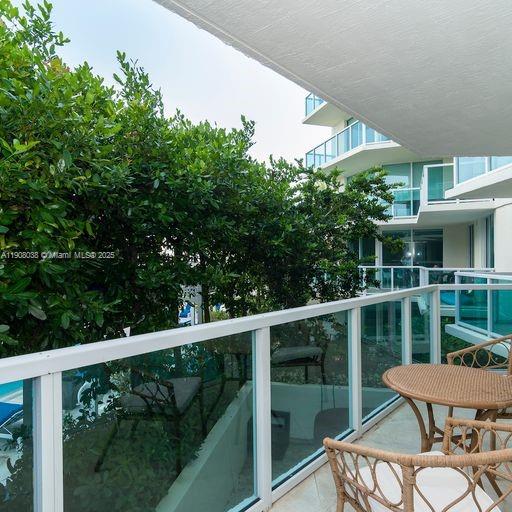 200 Sunny Isles Boulevard, Unit 2604 Sunny Isles Beach, FL 33160 - Photo 22 of 36 a view of a balcony with furniture
