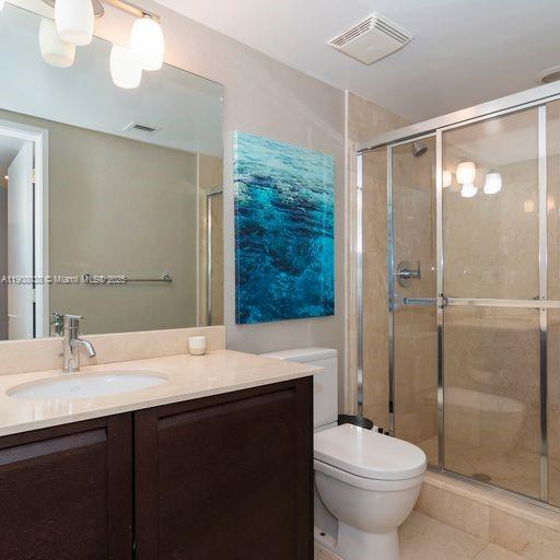 200 Sunny Isles Boulevard, Unit 2604 Sunny Isles Beach, FL 33160 - Photo 25 of 36 a bathroom with a sink and a mirror