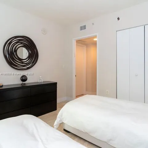 a bedroom with a bed and a closet