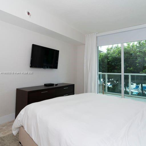200 Sunny Isles Boulevard, Unit 2604 Sunny Isles Beach, FL 33160 - Photo 5 of 36 a bedroom with a bed and a flat screen tv