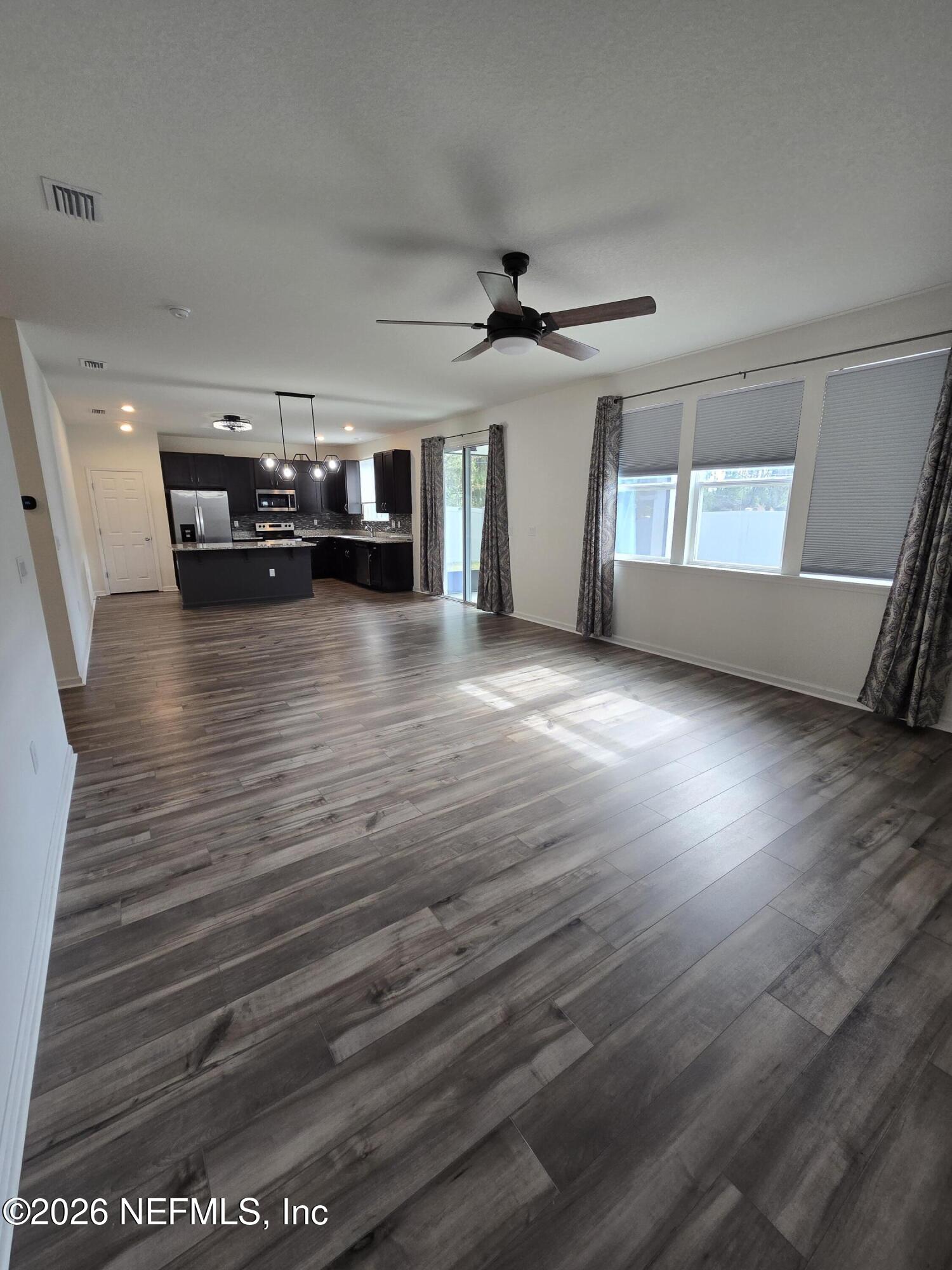 6788 Burnt Crk Road Jacksonville, FL 32222 - Photo 13 of 25 a view of a livingroom with furniture window and wooden floor