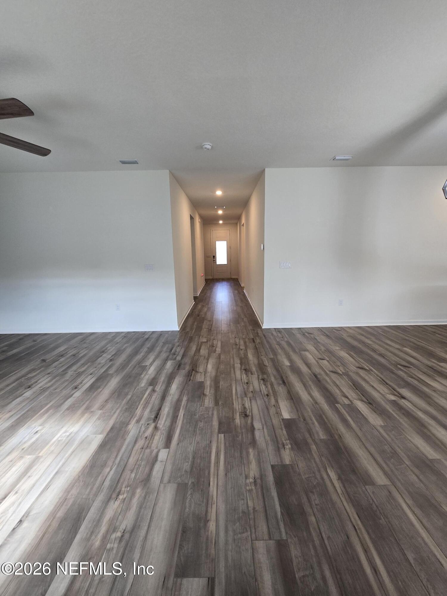 6788 Burnt Crk Road Jacksonville, FL 32222 - Photo 14 of 25 a view of empty room with wooden floor