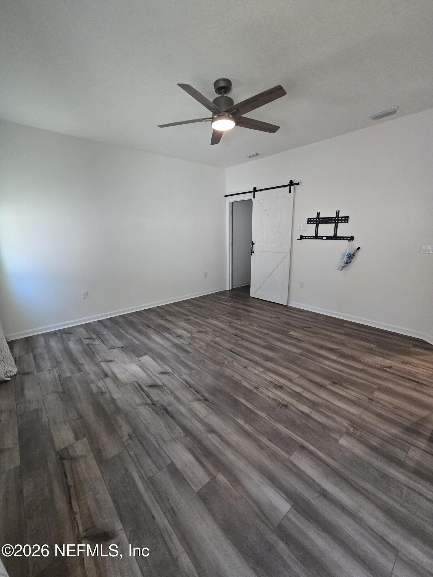 6788 Burnt Crk Road Jacksonville, FL 32222 - Photo 6 of 25 wooden floor in an empty room