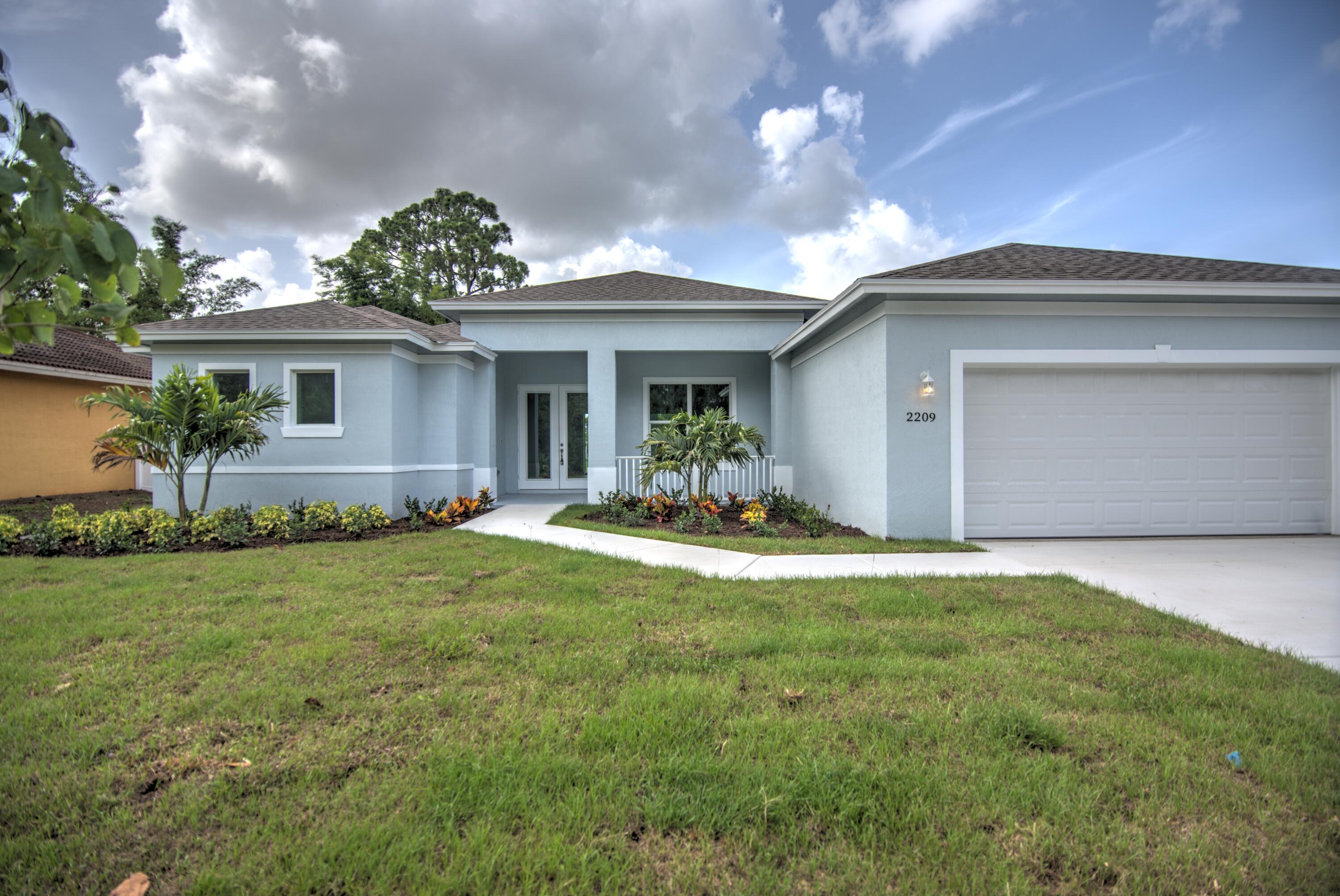 6705 Northwest Pinson Court Port St. Lucie, FL 34983 - Photo 1 of 25 a view of a house with swimming pool and a yard