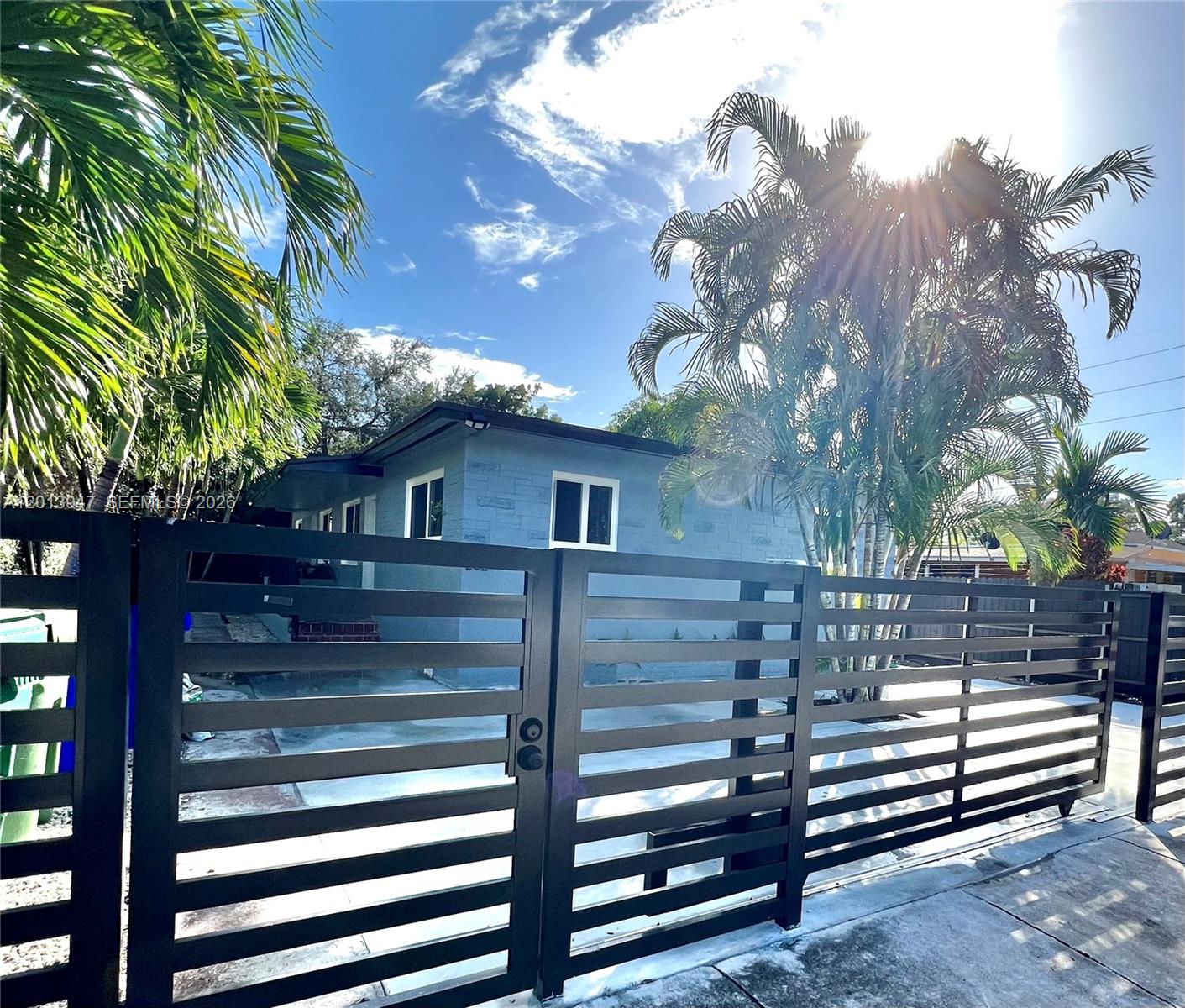 280 Northwest 55th Street, Unit 282 Miami, FL 33127 - Photo 1 of 19 a view of a house with a yard