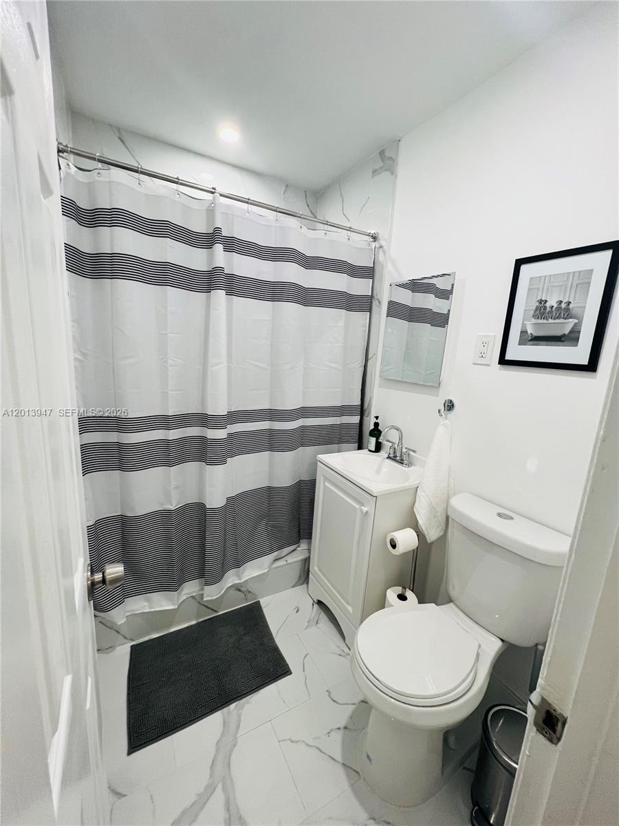 280 Northwest 55th Street, Unit 282 Miami, FL 33127 - Photo 19 of 19 a bathroom with a toilet and a shower