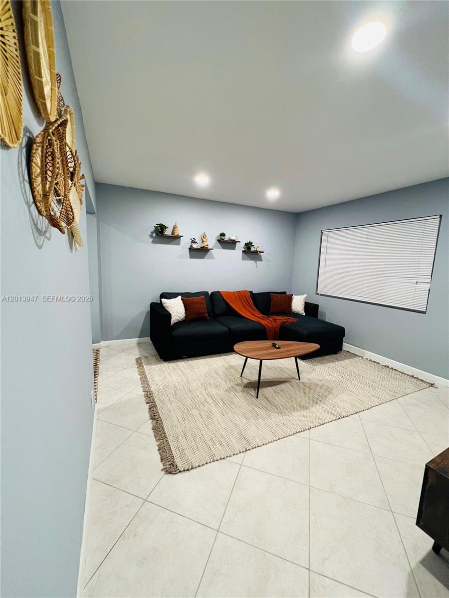 280 Northwest 55th Street, Unit 282 Miami, FL 33127 - Photo 5 of 19 a living room with furniture
