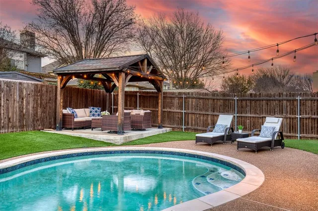 a view of a swimming pool with a patio