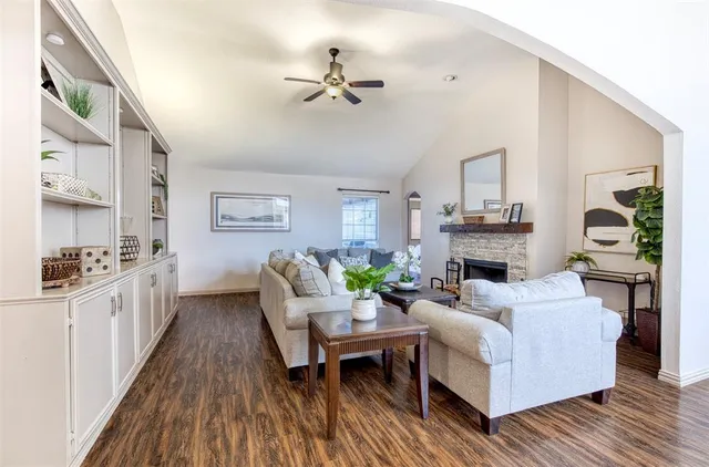 a living room with furniture and a fireplace