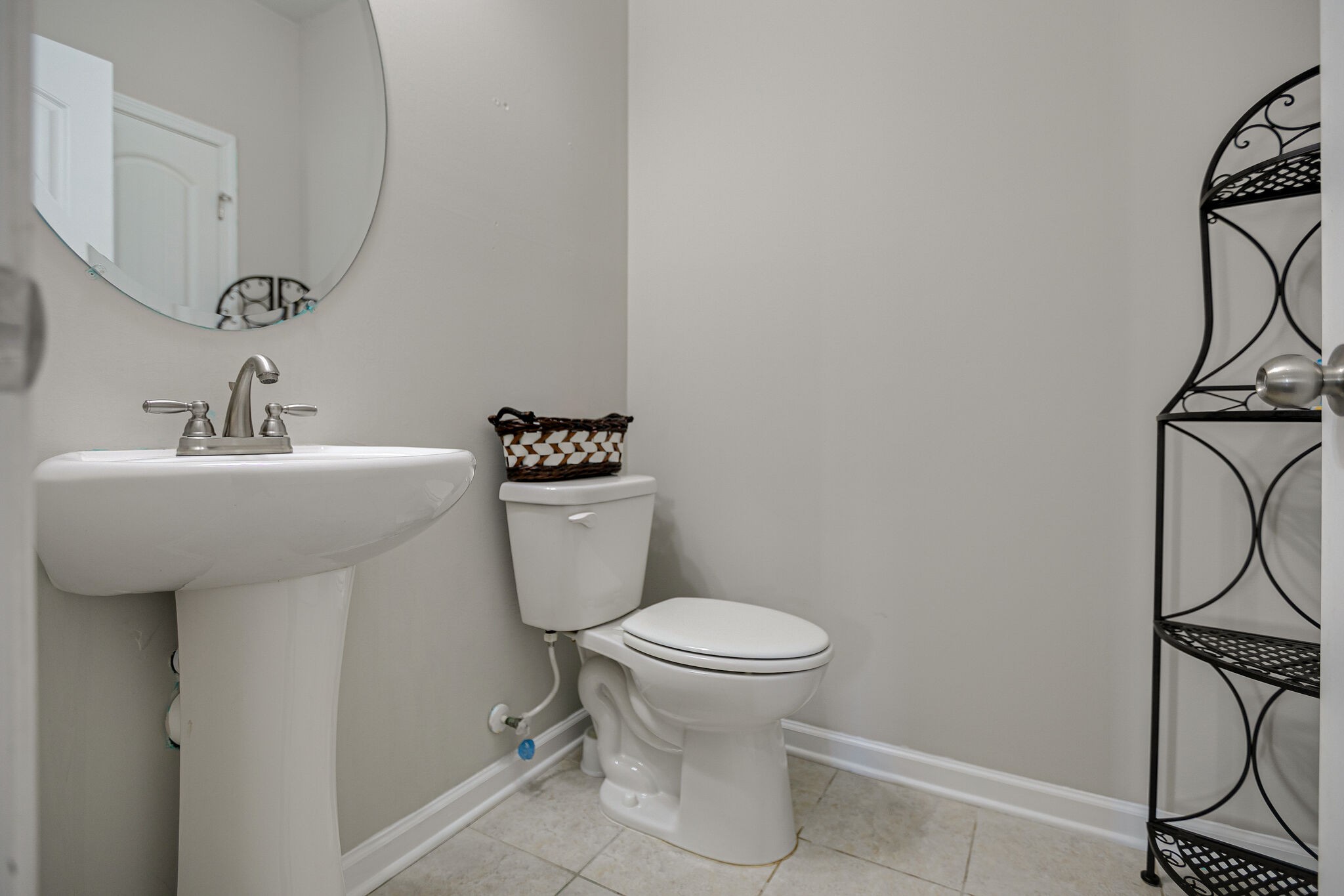 966 Carnation Drive Spring Hill, TN 37174 - Photo 17 of 31 a bathroom with a sink toilet and a mirror