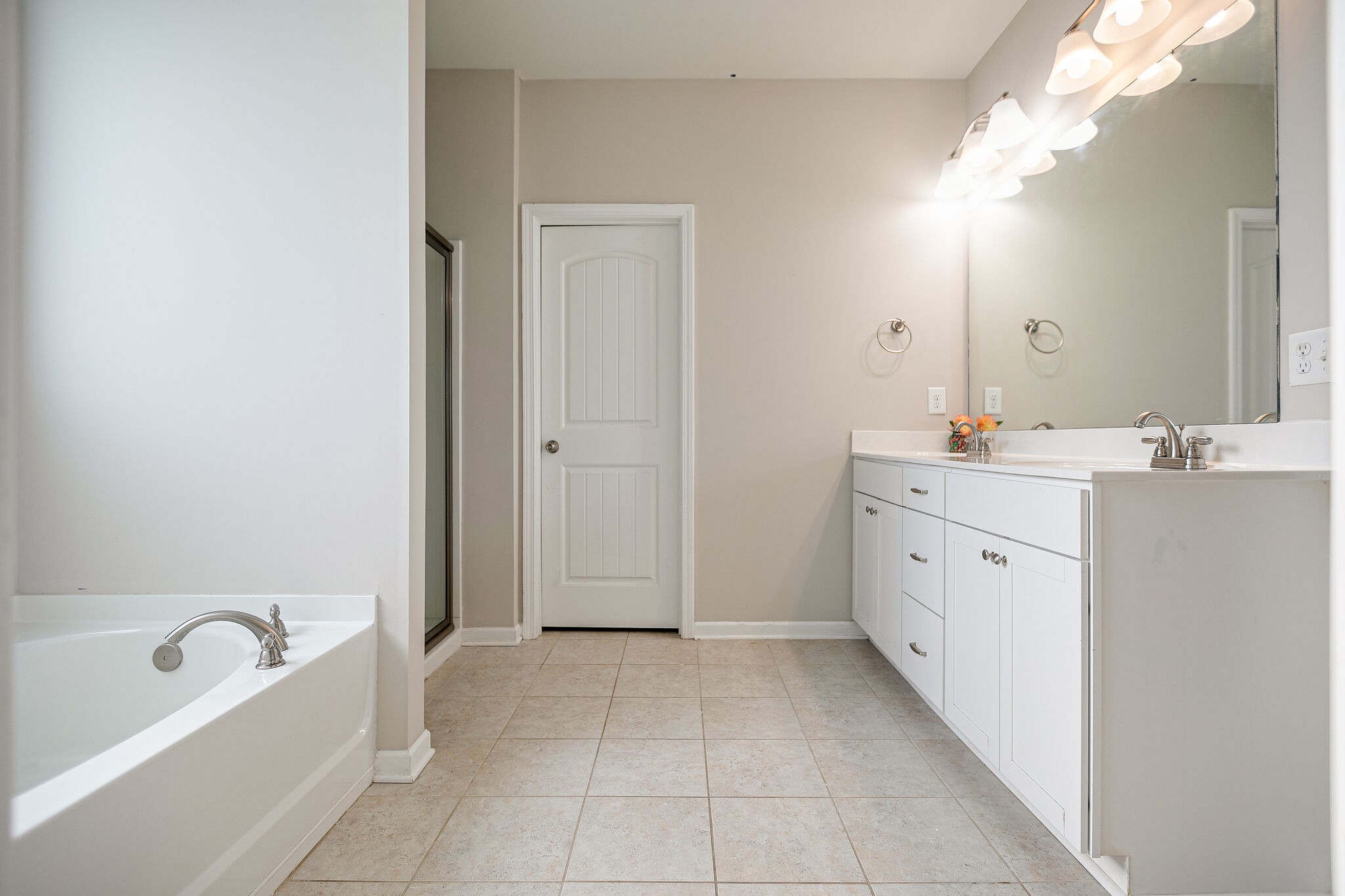 966 Carnation Drive Spring Hill, TN 37174 - Photo 20 of 31 a spacious bathroom with a bathtub sink and mirror
