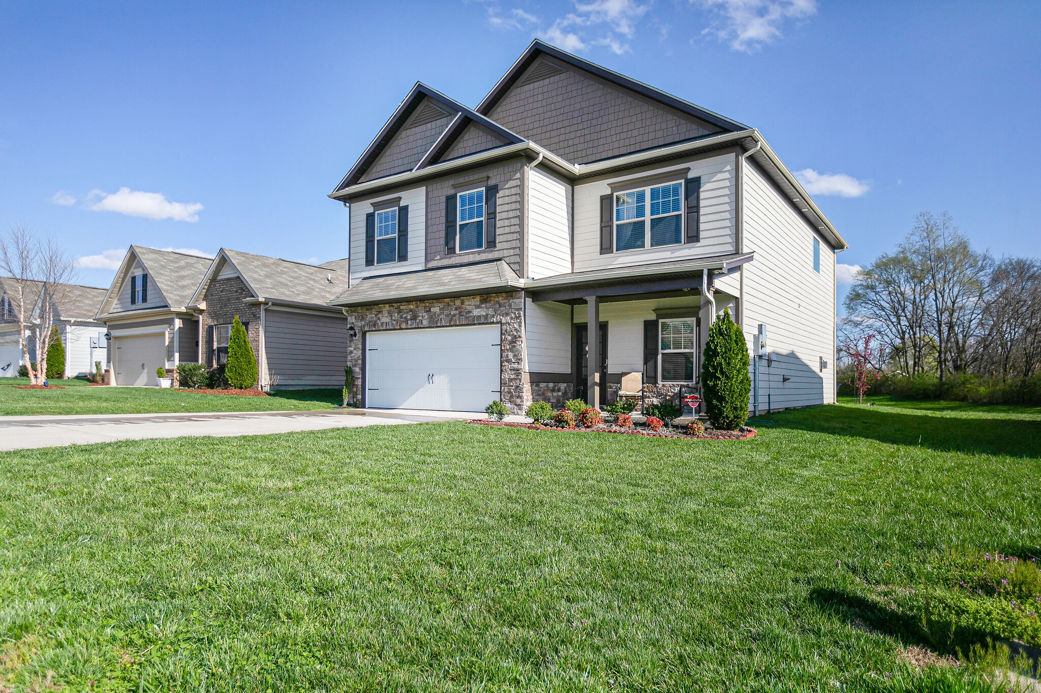 966 Carnation Drive Spring Hill, TN 37174 - Photo 2 of 31 a view of a house with a yard and sitting area