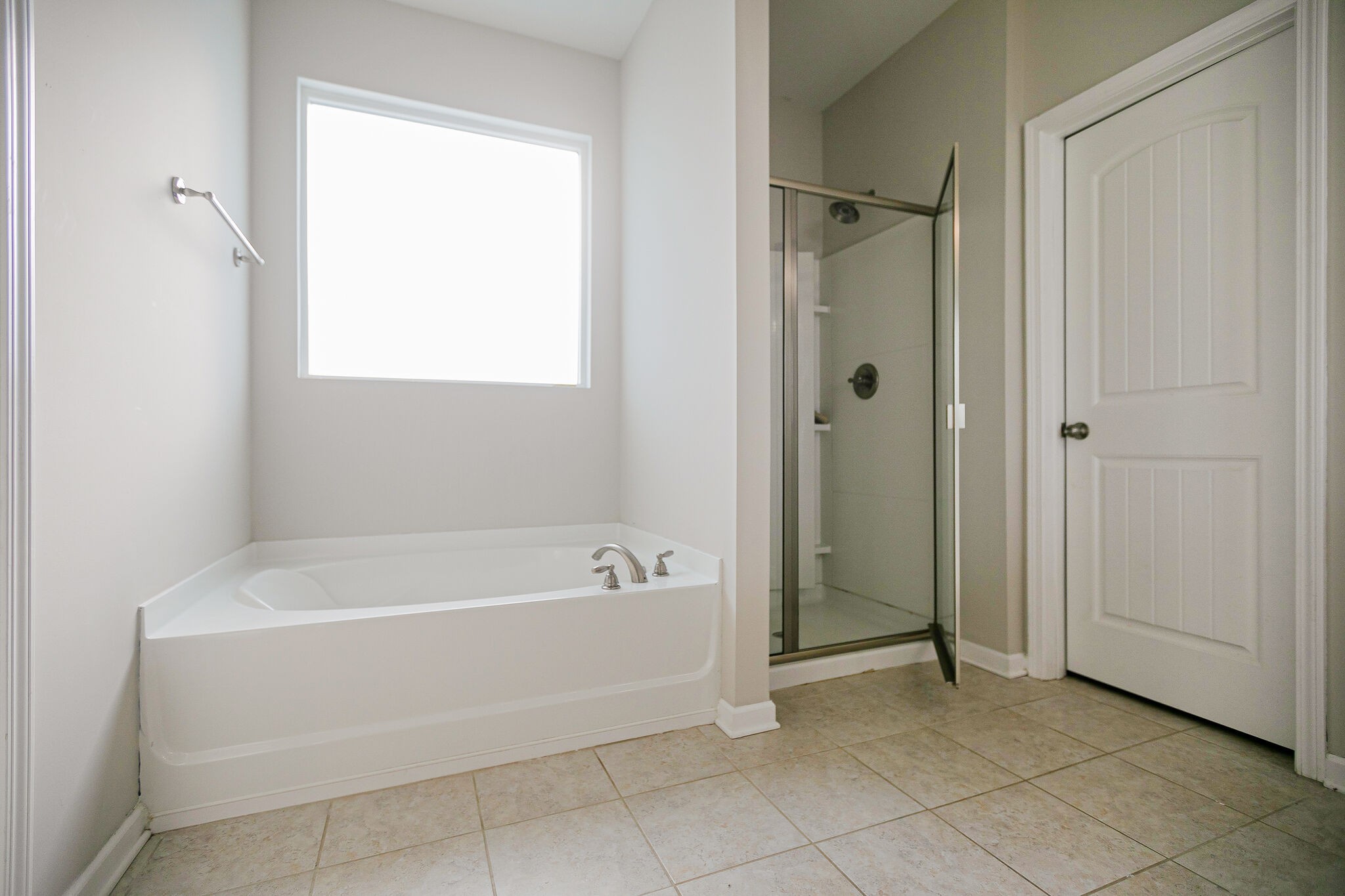 966 Carnation Drive Spring Hill, TN 37174 - Photo 21 of 31 a spacious bathroom with a bathtub and a shower