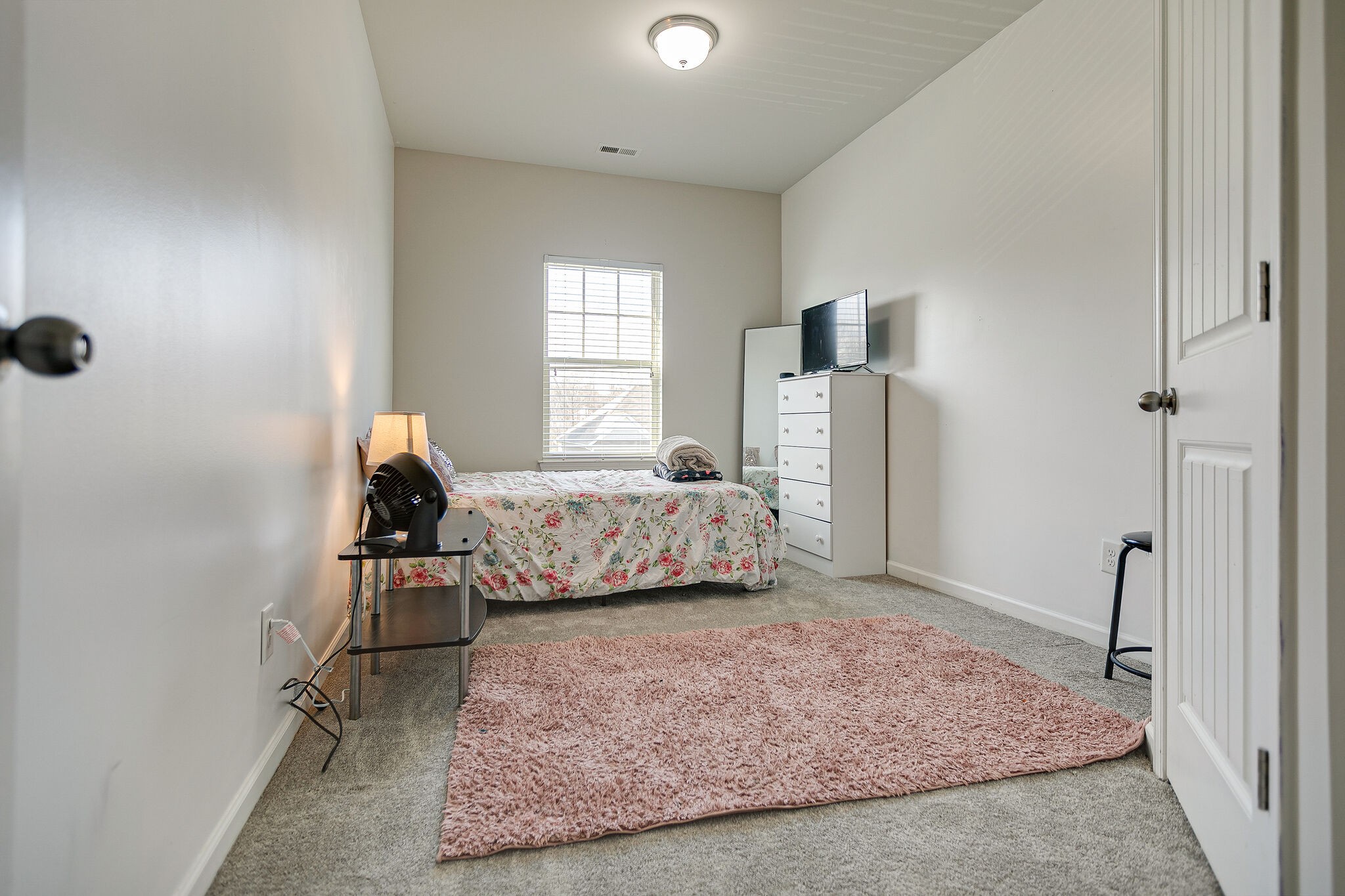 966 Carnation Drive Spring Hill, TN 37174 - Photo 22 of 31 a bedroom with a bed and a window