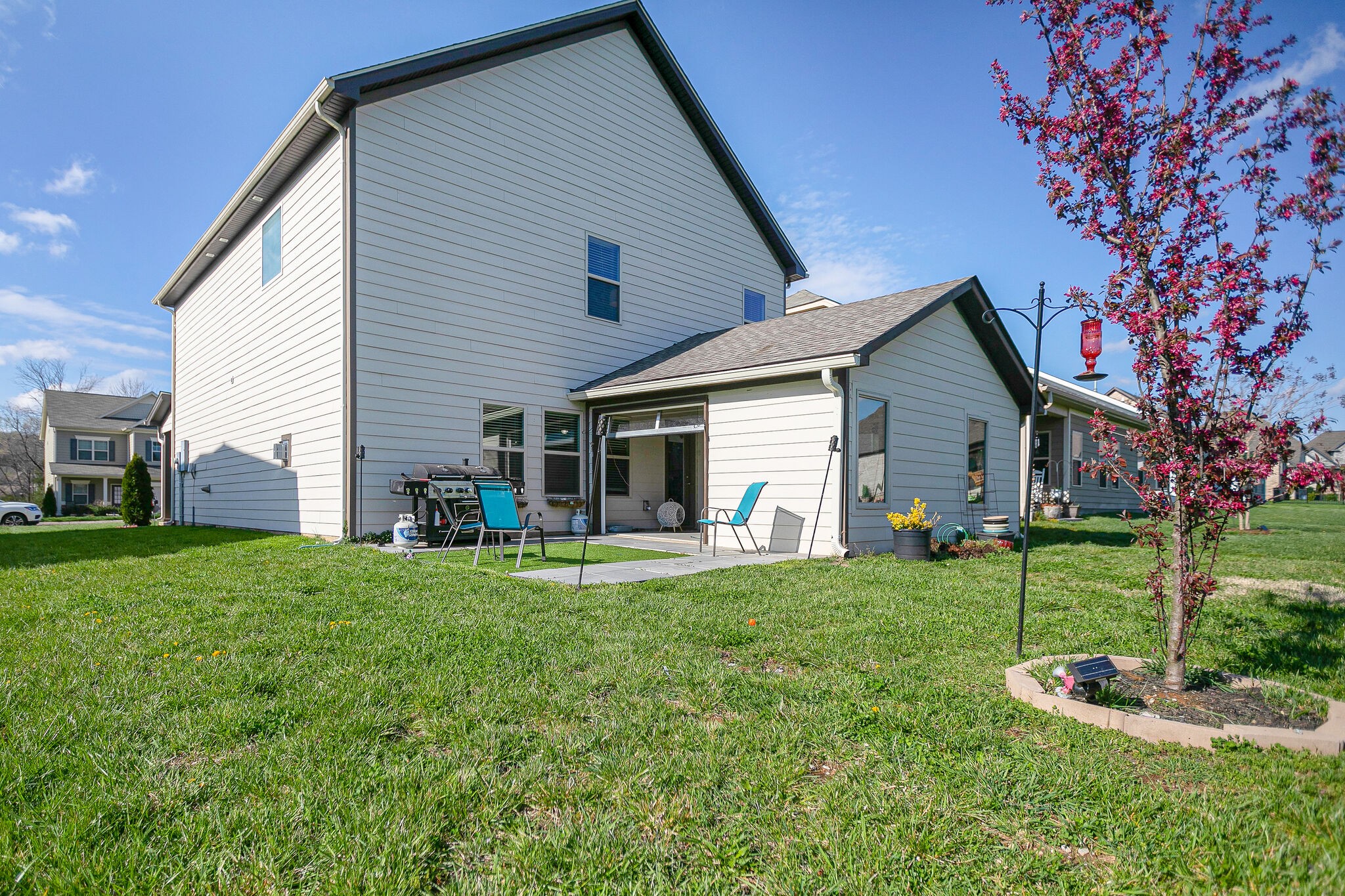 966 Carnation Drive Spring Hill, TN 37174 - Photo 30 of 31 a view of a house with a yard and sitting area