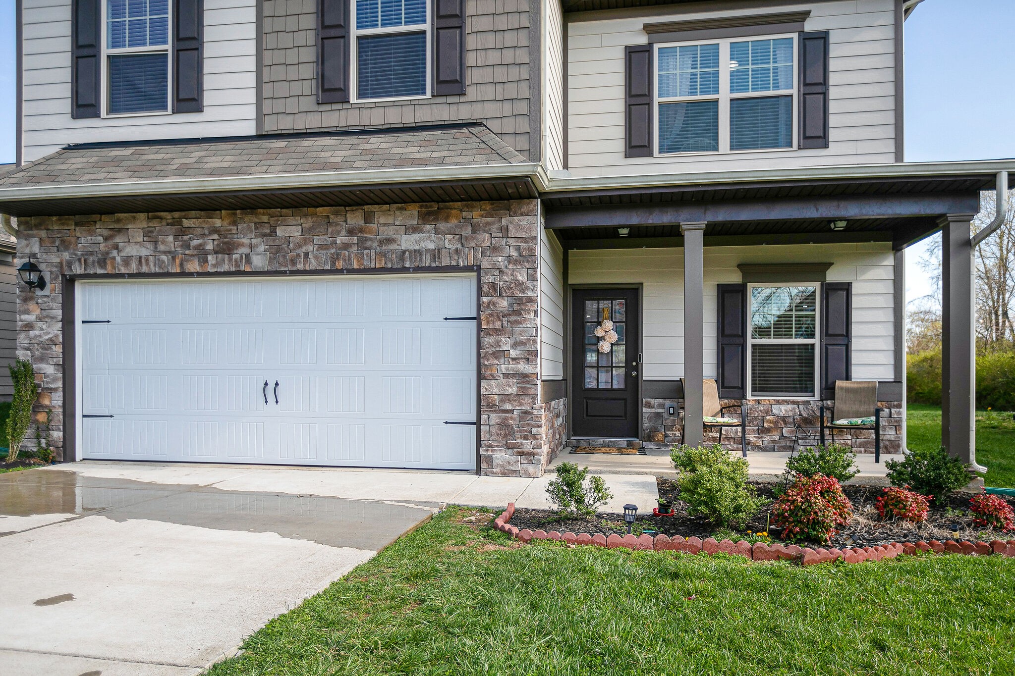 966 Carnation Drive Spring Hill, TN 37174 - Photo 3 of 31 a front view of a house with a yard