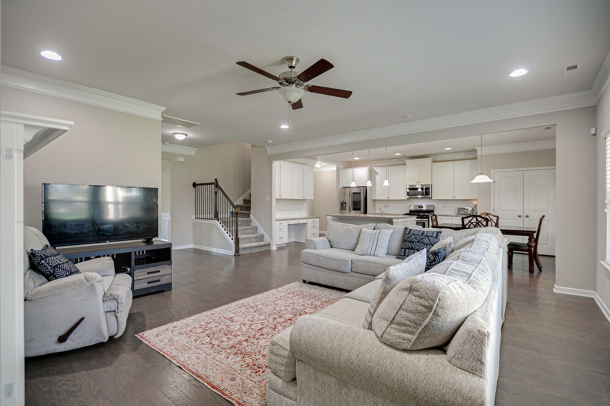 966 Carnation Drive Spring Hill, TN 37174 - Photo 10 of 31 a living room with furniture and a flat screen tv