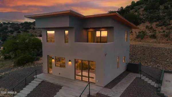 a front view of a house with parking area