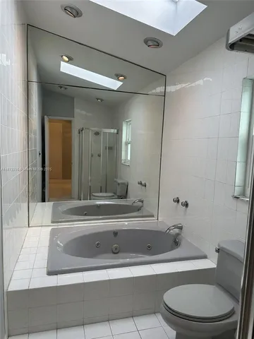 a bathroom with a sink a toilet and a bathtub